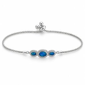 Three oval blue opals with crystal halo · 306L